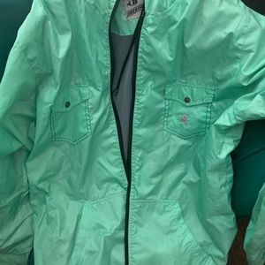 Teal green jibberish windbreaker